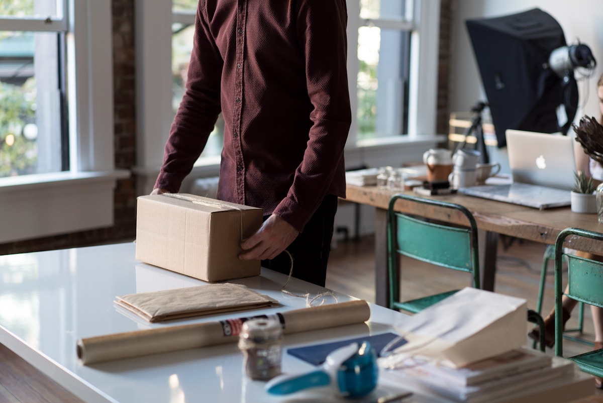 A small business team packing an online order